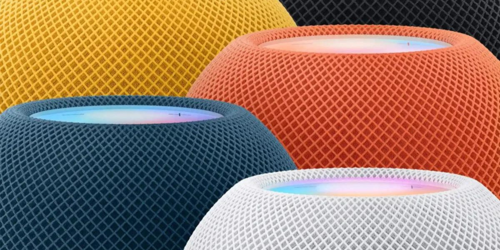 Cinco homepod mini en azul, blanco, amarillo, naranja y negro